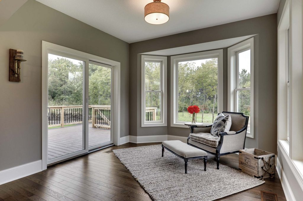 A Bay Window And Sliding Patio Doors In A Reading Nook 