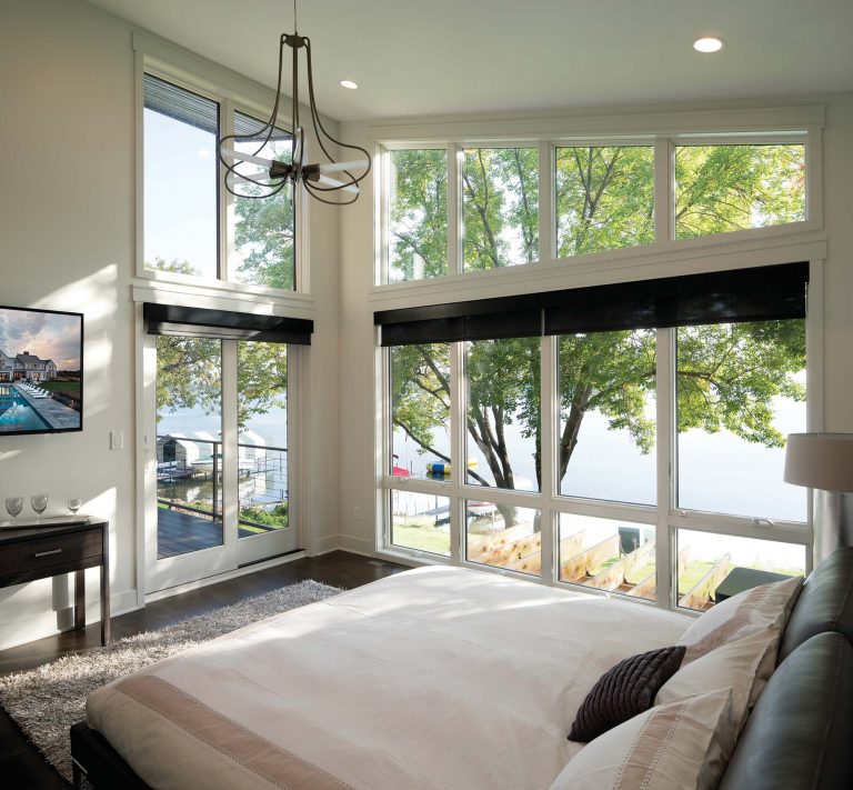Floor To Ceiling Windows In A Vaulted Main Bedroom